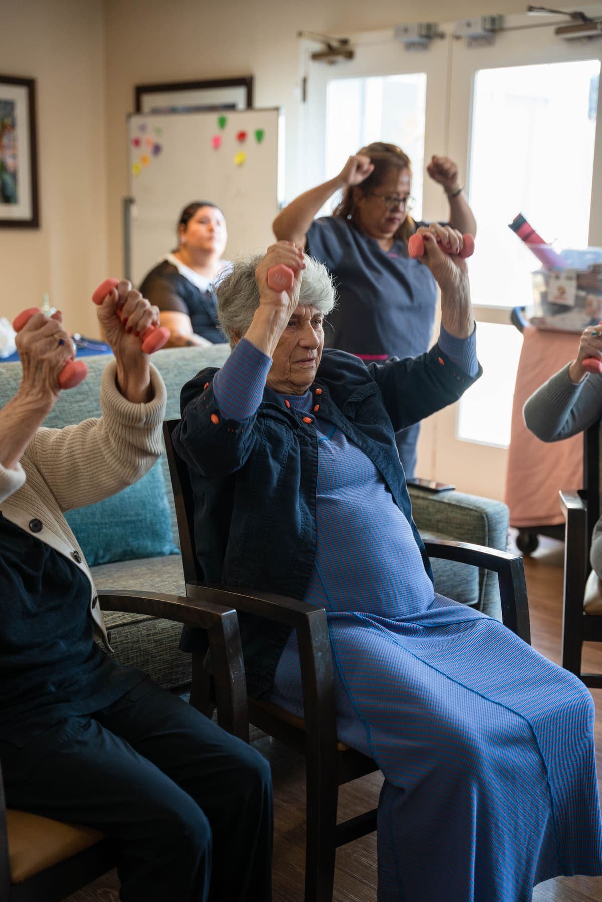 Seated exercise class with hand weights