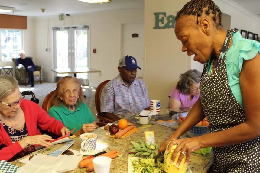 Residents prepare food with a chef