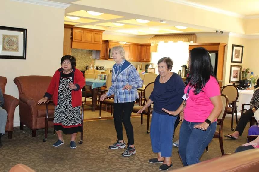 Residents and team members take part in a movement class